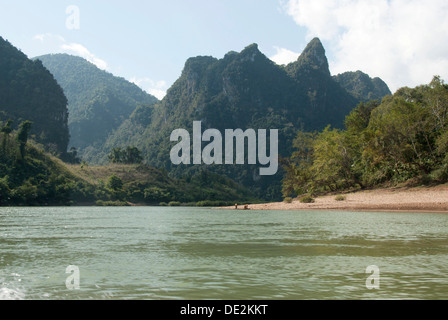 Karst landscape, forested mountains on the Nam Ou River in Muang Ngoi Kao, Luang Prabang province, Laos, Southeast Asia, Asia
