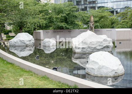 WASHINGTON DC, USA - A reflection pool with large rocks at the Memorial to Japanese-American Patriotism in World War II near the US Capitol in Washington DC. The memorial was designed by Davis Buckley and Nina Akamu and commemorates those held in Japanese American internment camps during World War II. Stock Photo
