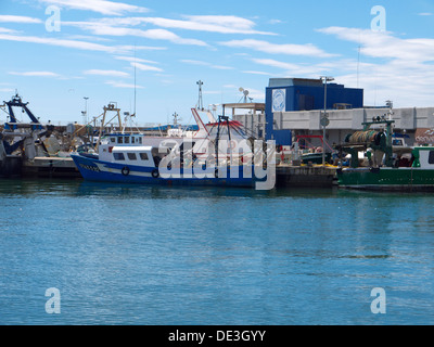 Fishing boats moored up in the harbor Stock Photo