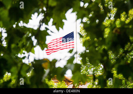 Grosvenor Square, London, UK. 11th Sep, 2013. The United States flag flies at hal mast at the US Embassy in London on the anniversary of the 9-11 terrorist attacks on America. Credit:  Paul Davey/Alamy Live News Stock Photo