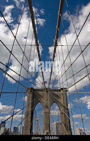 portrait view of brooklyn bridge tower and flag Stock Photo