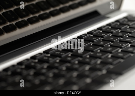 A close-up of a keyboard of a beautifully designed modern laptop computer Stock Photo