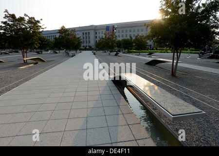 Arlington, Virginia, USA. 11th Sep, 2013. The sun rises over the Pentagon and the Pentagon Memorial on September 11, 2013. United States President Barack Obama will commemorate the 12th anniversary of the 9/11 terrorist attacks that killed nearly 3,000 people in New York, Washington and Shanksville, Pennsylvania. There are 184 benches in the Pentagon Memorial representing the 184 people who died at the Pentagon on September 11, 2001. Credit: Pat Benic / Pool via CNP Credit:  dpa picture alliance/Alamy Live News Stock Photo