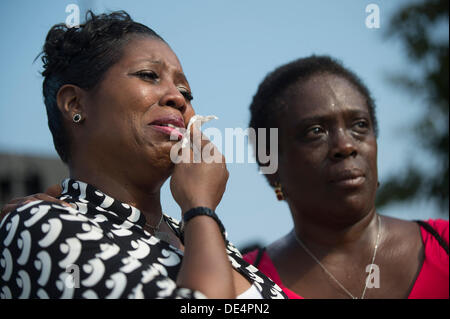 Arlington, Virginia, USA. 11th Sep, 2013. A woman becomes emotional during a remembrance ceremony for the 12th anniversary of the 9/11 terrorist attacks, at the Pentagon on September 11, 2013 in Arlington, Virginia. Credit: Kevin Dietsch / Pool via CNP Credit:  dpa picture alliance/Alamy Live News Stock Photo