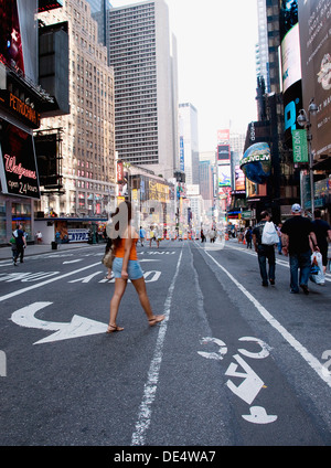 People walking around Times Square in NYC when it is closed down to traffic. Stock Photo