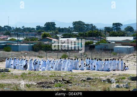 Religious group gathers for payers in Khayelitsha, a partially informal township in Cape Town, Western Cape, South Africa Stock Photo