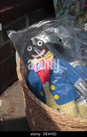 Golly (golliwogg) dolls on sale outside a tourist shop in Burley, New Forrest, Hampshire, UK. Stock Photo