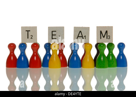 Game figures and letter tiles, spelling the word team Stock Photo