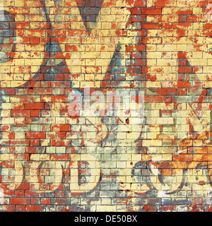 An Old Grunge Red Brick Wall with Painted Letters Stock Photo