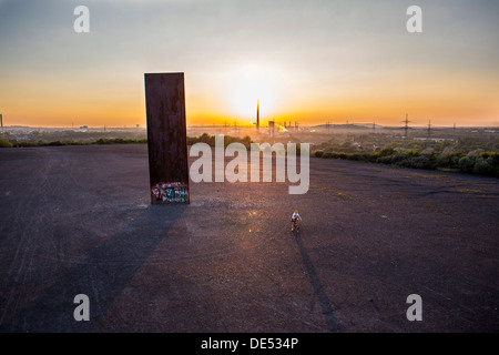 Sculpture 'Bramme' on an artificial hill, a stockpile. 20 Meters high steel slab. Essen, Germany. Stock Photo