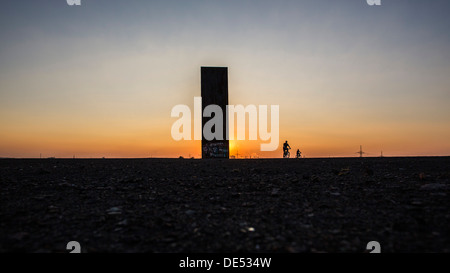 Sculpture 'Bramme' on an artificial hill, a stockpile. 20 Meters high steel slab. Essen, Germany. Stock Photo