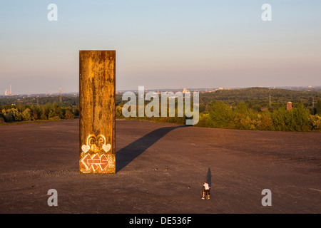 Sculpture 'Bramme' on an artificial hill, a stockpile. 20 Meters high steel slab. Essen, Germany. Stock Photo