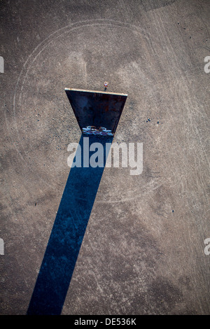 Sculpture 'Bramme' on an artificial hill, a stockpile. 20 Meters high steel slab. Essen, Germany. Stock Photo