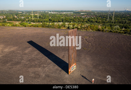 Sculpture 'Bramme' on an artificial hill, a stockpile. 20 Meters high steel slab. Essen, Germany. Stock Photo