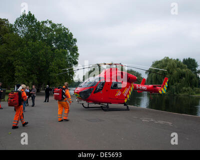 London, UK. 11th Sep, 2013. London's Air Ambulance, also known as London HEMS (Helicopter Emergency Medical Service), lands in Regent's Park in response to an injured casualty in Baker Street on 11th September 2013. Regent's Park is one of its designated landing areas in London. © PD Amedzro/Alamy Live News Stock Photo