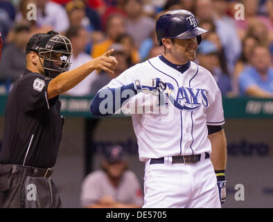 St. Petersburg, Florida, USA. 11th Sep, 2013. JAMES BORCHUCK | Times.Home plate umpire Vic Carapazza signals for Evan Longoria to take a base after he was hit by a Ryan Dempster pitch in the third inning during the Tampa Bay Rays game against the Boston Red Sox at Tropicana Field in St. Petersburg, FL Wednesday, Sept. 11, 2013. © James Borchuck/Tampa Bay Times/ZUMAPRESS.com/Alamy Live News Stock Photo