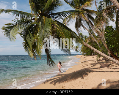 Woman, 45, walking along a secluded beach, Punta Uva, Puerto Viejo de Talamanca, Costa Rica, Central America Stock Photo