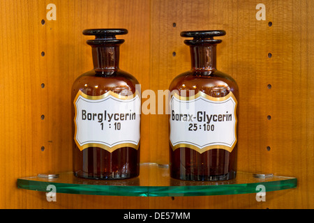 Old glass bottles for medical ingredients labeled glycerin in a pharmacy, Stuttgart, Baden-Wuerttemberg Stock Photo