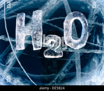 Chemical formula of water H2O made from ice on winter frozen lake Baikal  Stock Photo