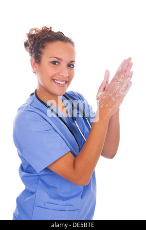young nurse washing hands with soap isolated Stock Photo