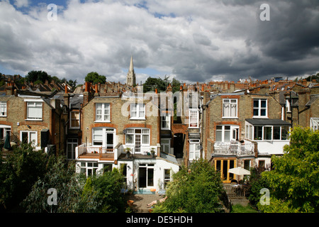 View over the rooftops of suburban houses to St James's church on Muswell Hill, London, UK Stock Photo