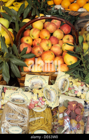 Montepulciano, Tuscany, Italy. Local food fresh fruit and pasta farm produce display for sale in street shop. Apples, oranges Stock Photo