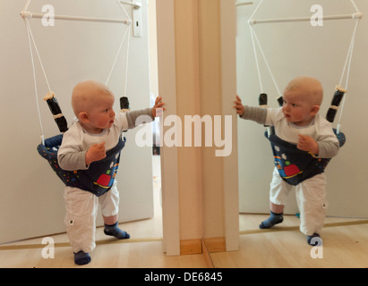 Freiburg, Germany, a baby Baby Bouncer in front of a mirror Stock Photo