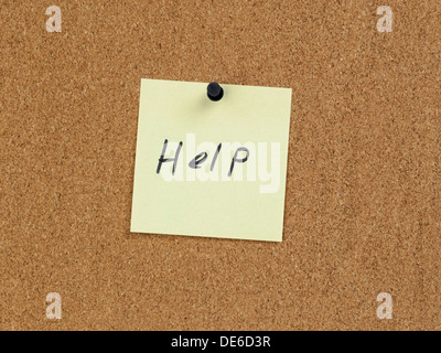help reminder note on cork board, handwritten Stock Photo