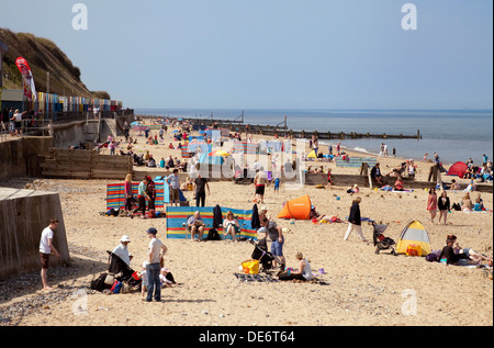 Crowded english beach scene, May Bank Holiday weekend; Mundesley beach, Norfolk coast, UK Stock Photo