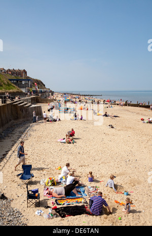 People enjoying a sunny may bank holiday weekend on Mundesley Beach, Norfolk Coast England UK Stock Photo