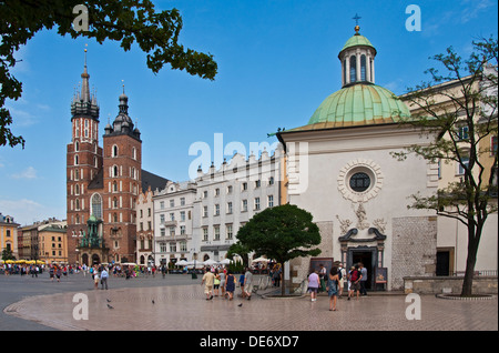 Krakow Main Market Square with Church of St. Mary, left, and Church of Wojciech (St. Adalbert), right. Stock Photo