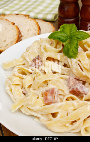 close up of a plate of tagliatelli carbanara italian cuisine in a traditional restaurant setting