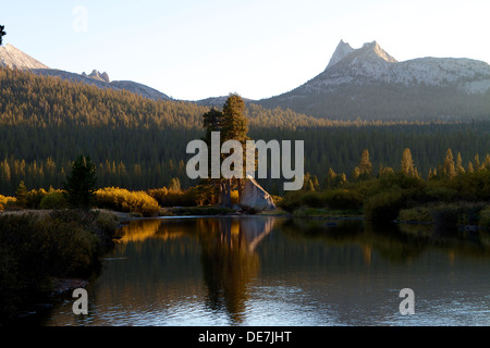 The Tuolumne river as the sunsets on Tuolumne meadows with Cathedral peak in the background in Yosemite National park California USA Stock Photo