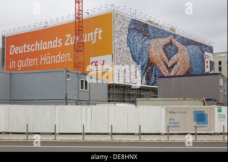 Large poster of the CDU German Chancellor Angela Merkel,  with a typical attitude called the 'Merkel rhombus', Berlin Stock Photo