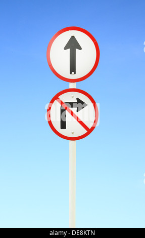 go ahead the way ,forward sign and don't turn right sign with blue sky Stock Photo