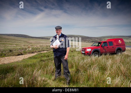 Postman in the Pennines , Yorkshire delivering mail to remote farms on the tops Stock Photo