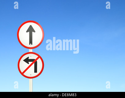 go ahead the way ,forward sign and don't turn left sign with blue sky blank for text Stock Photo