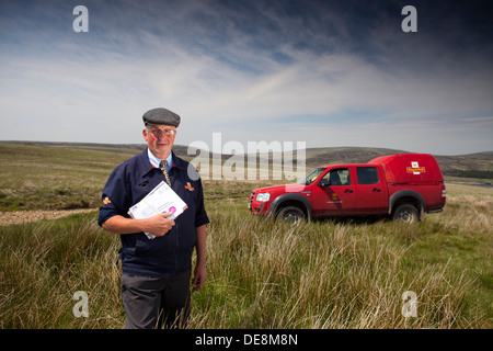 Postman in the Pennines , Yorkshire delivering mail to remote farms on the tops Stock Photo