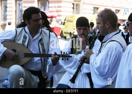 Members of the folk group Rizes in Greek national costume during the 47th Folklore Festival in Zagreb, Croatia on July 19,2013 Stock Photo