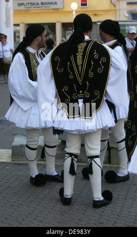 Members of the folk group Rizes in Greek national costume during the 47th Folklore Festival in Zagreb, Croatia on July 19,2013 Stock Photo