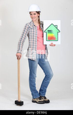 Builder with energy rating sign Stock Photo