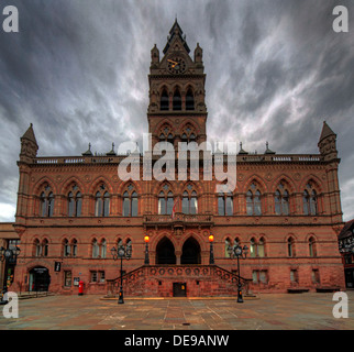 Front view of Chester Town Hall, Northgate Street, in the evening, showing its Gothic architecture and stormy sky over the city centre. Stock Photo