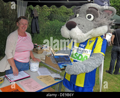 Warrington Wolves Mascot Wolfie at Grappenhall Walking Day, Community Library stall, Warrington, Cheshire,England,UK Stock Photo