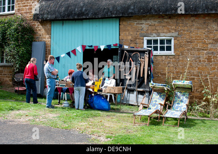 Bric-a-brac stall at Warmington village fete, Warwickshire, UK Stock Photo