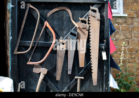 Display of old tools at Warmington village fete, Warwickshire, UK Stock Photo