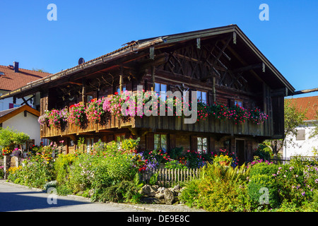 Old wooden house, Stupperhaus in 1685, with floral decoration in Bernried on Lake Starnberg in Bavaria Stock Photo