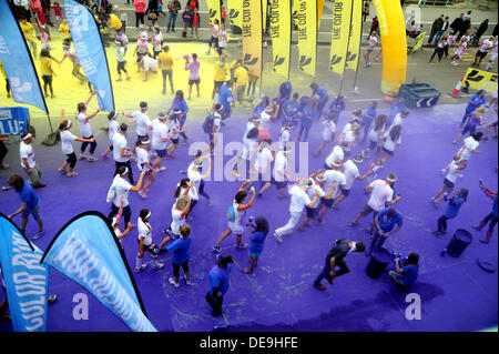 Brighton Sussex UK 14 September 2013 -Thousands of people taking part in the Dulux Color Run along Brighton seafront today Stock Photo