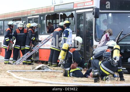 Hamburg, Germany. 14th Sep, 2013. Rescue works take part in an training exercise with injured people on a city bus in Hamburg, Germany, 14 September 2013. City officials and municipal organizations are carrying out an emergency planning exercise with a fictional aircrash involving two planes over the city. Photo: BODO MARKS/dpa/Alamy Live News Stock Photo