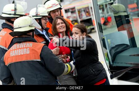 Hamburg, Germany. 14th Sep, 2013. Rescue works take part in an training exercise rescuing injured people at the Airbus factory in Hamburg, Germany, 14 September 2013. City officials and municipal organizations are carrying out an emergency planning exercise with a fictional aircrash involving two planes over the city. Photo: SVEN HOPPE/dpa/Alamy Live News Stock Photo