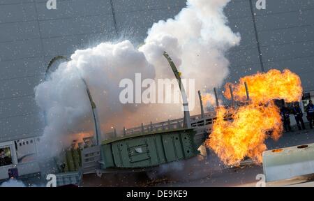 Hamburg, Germany. 14th Sep, 2013. A fake plane burns during an training exercise at the Airbus factory in Hamburg, Germany, 14 September 2013. City officials and municipal organizations are carrying out an emergency planning exercise with a fictional aircrash involving two planes over the city. Photo: SVEN HOPPE/dpa/Alamy Live News Stock Photo
